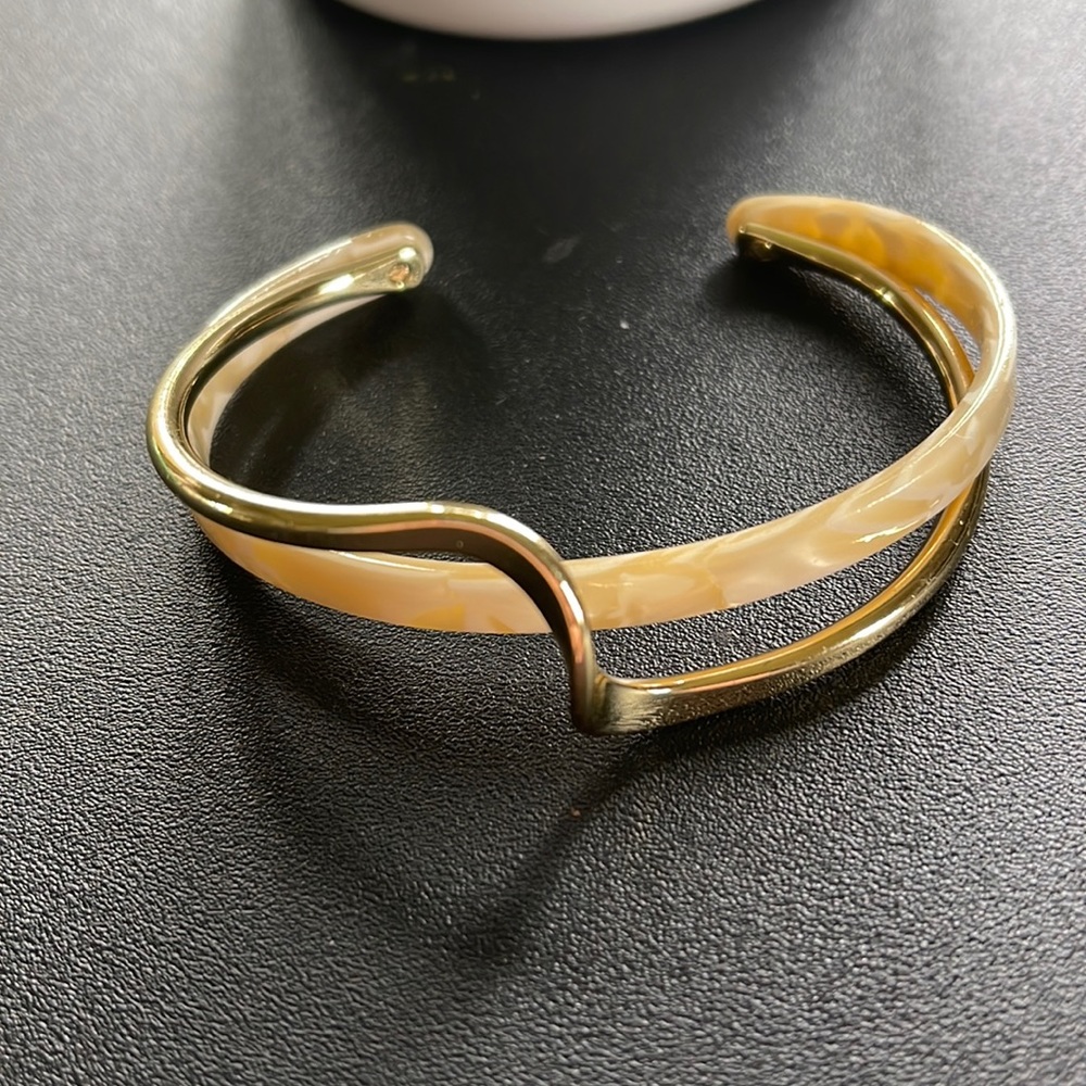 Two row cuff bracelet with a semi circle cuff Gold plated.